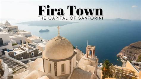 Fira, the capital of Santorini .